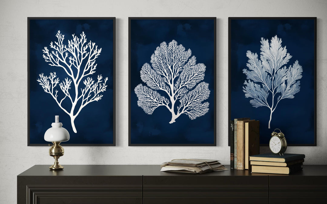 Set of three nautical canvas wall art panels featuring white sea corals on a navy blue background.