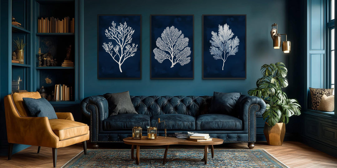 Set of three vertical canvas wall art panels featuring white sea corals on a navy blue background.