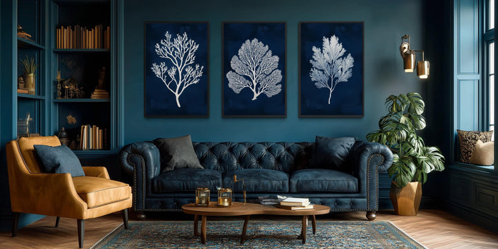 Set of three vertical canvas wall art panels featuring white sea corals on a navy blue background.