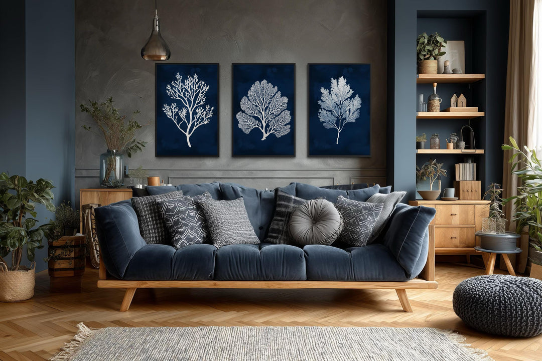 Set of three vertical canvas wall art panels featuring white sea corals on a navy blue background.