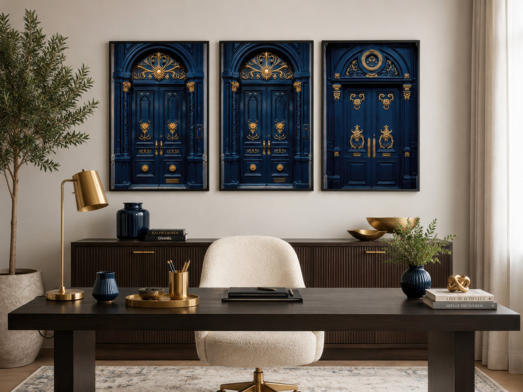 Set of three framed navy blue and gold European door canvas prints hanging in a home office.