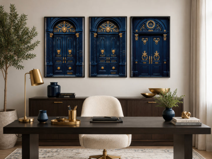 Set of three framed navy blue and gold European door canvas prints hanging in a home office.