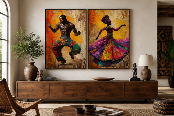 Two framed canvas prints of an African man and woman dancing in vibrant, traditional attire.