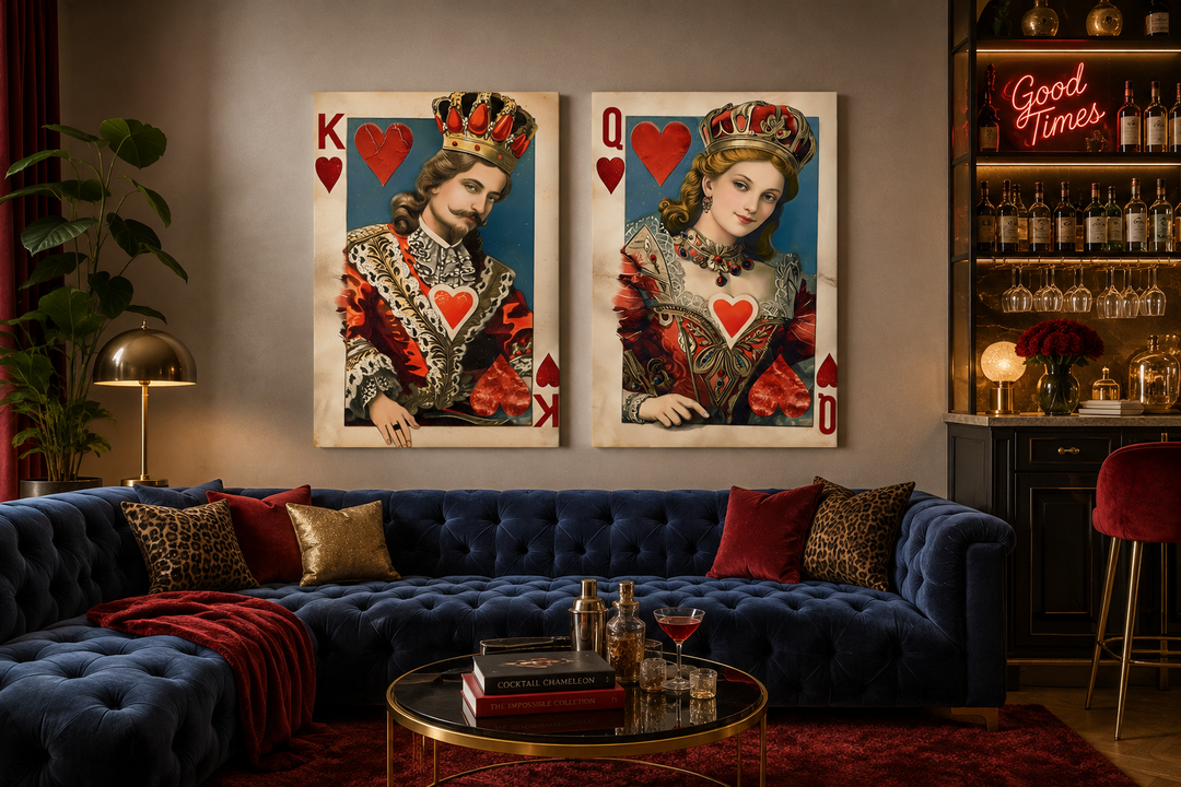 Set of 2 King and Queen of Hearts framed canvas wall art above a blue velvet sofa in a game room.