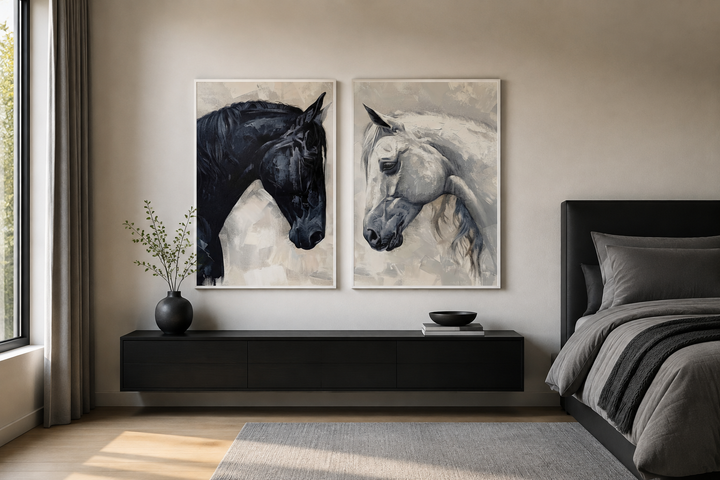 Set of 2 framed canvas prints featuring black and white horse portraits above a black console.