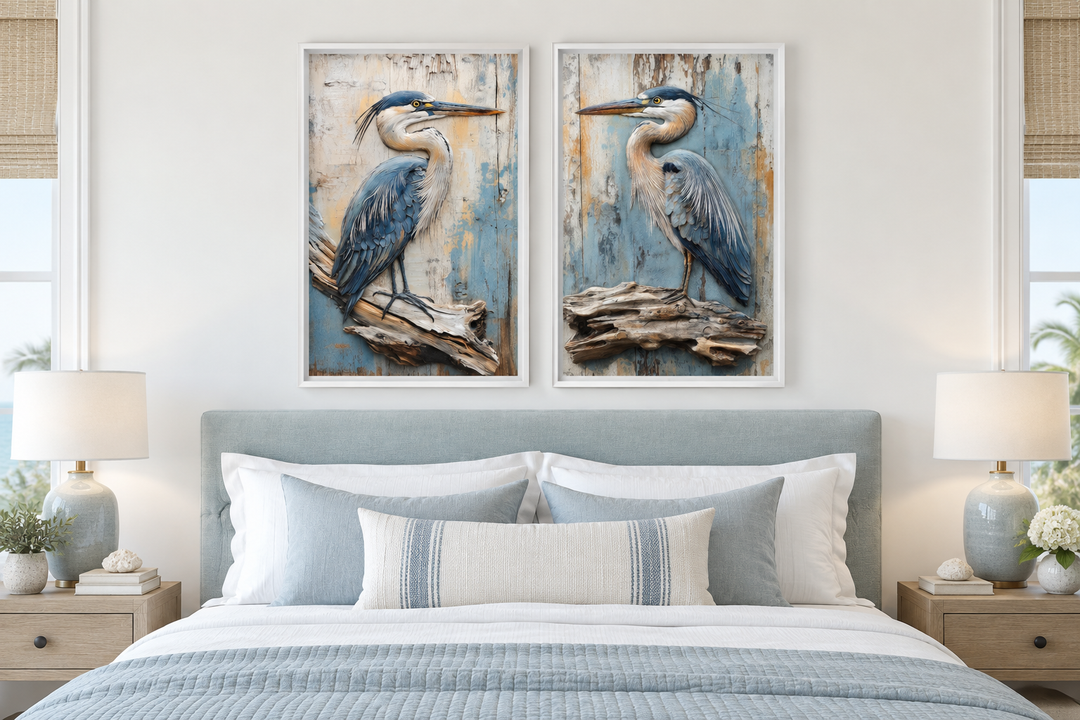 Set of 2 rustic blue herons on driftwood framed canvas wall art hanging above a bed.