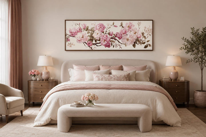 Shabby chic pink and green floral long horizontal wall art hanging above a bed in a bedroom.