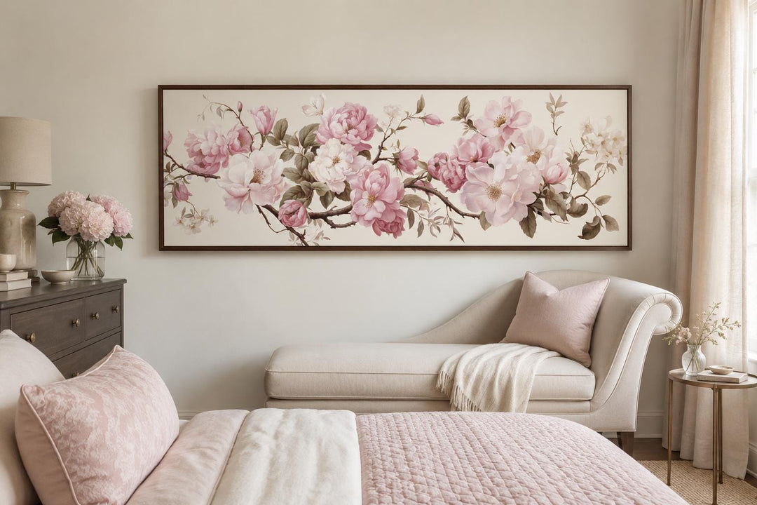 Shabby chic long horizontal wall art with pink and white flowers above a bed and chaise lounge.