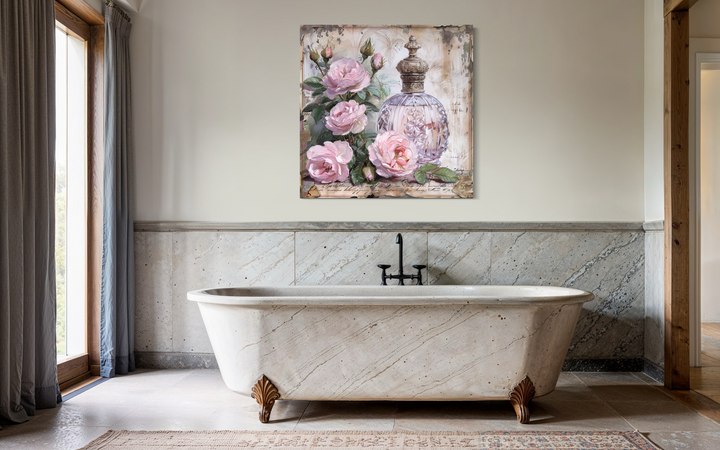 Shabby chic framed canvas wall art featuring a vintage pink perfume bottle and roses.