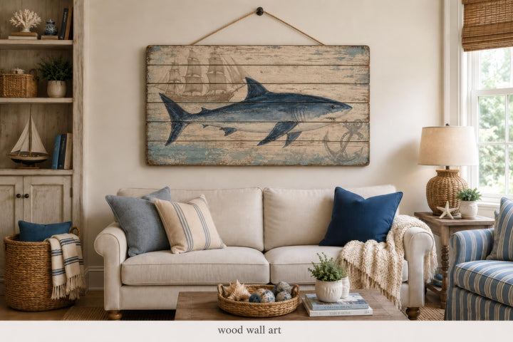Distressed wood panel wall art featuring a blue shark and nautical ship illustration.