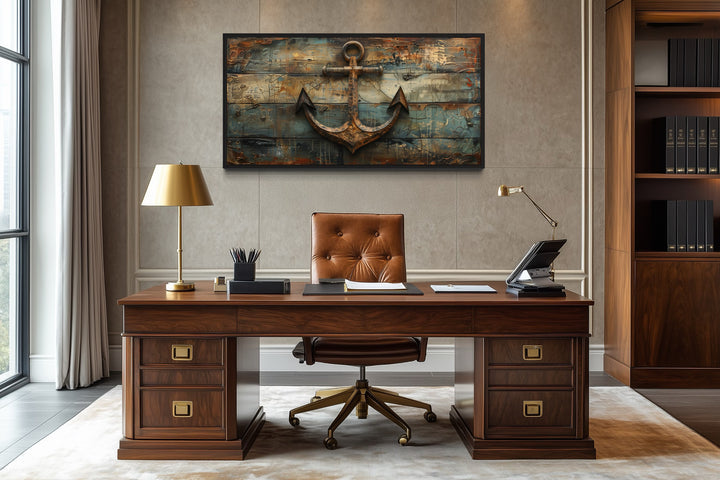 Nautical framed canvas wall art featuring a rusty ship's anchor painted on weathered wood.
