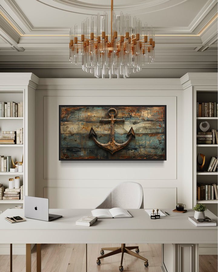 Ship's anchor painted on weathered wood nautical framed canvas wall art above a modern office desk.