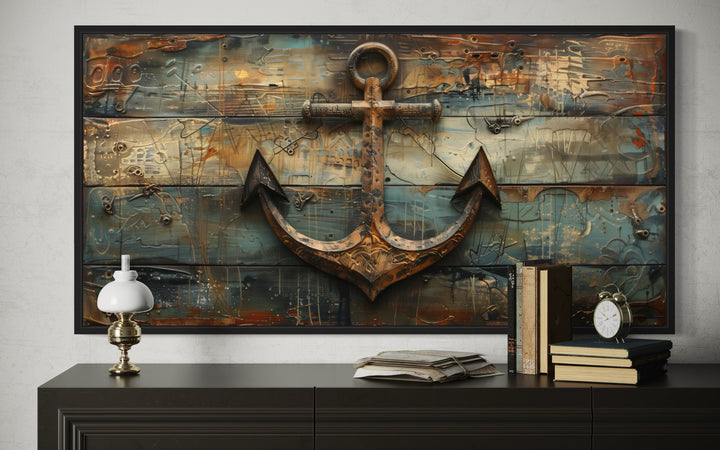 Framed nautical canvas wall art featuring a rusty ship's anchor on a weathered wood background.