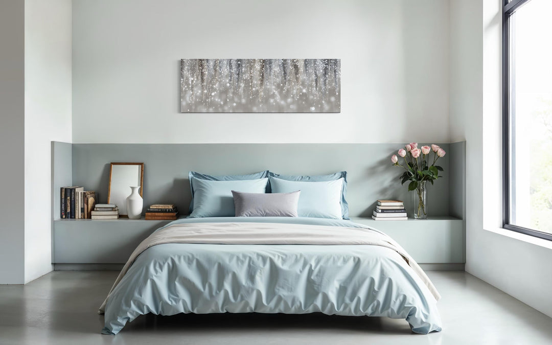 Silver beige abstract rain canvas print hanging above a bed in a modern, minimalist bedroom.