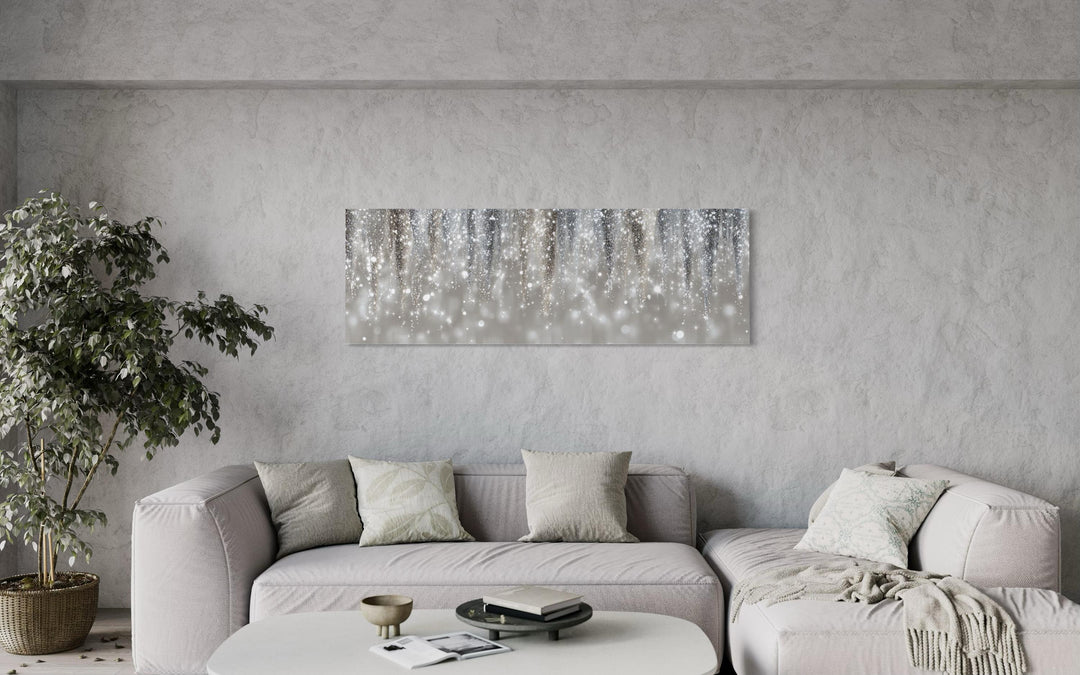 Silver beige abstract rain canvas print hanging above a neutral sofa in a modern living room.