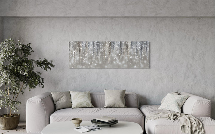 Silver beige abstract rain canvas print hanging above a neutral sofa in a modern living room.