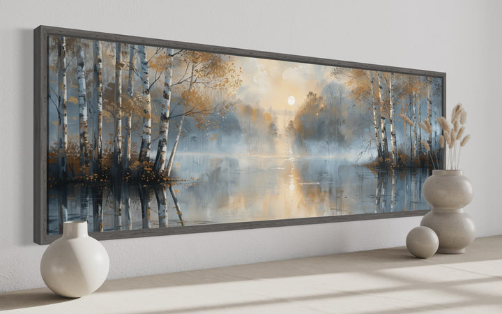 Panoramic wall art of a misty silver birch forest over a lake in a dark wood frame.