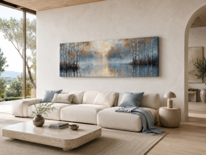 Silver birch trees forest long narrow horizontal wall art hanging above a white sofa.