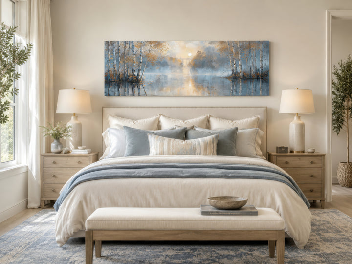 Silver birch trees forest long narrow horizontal wall art hanging above a bed in a serene bedroom.