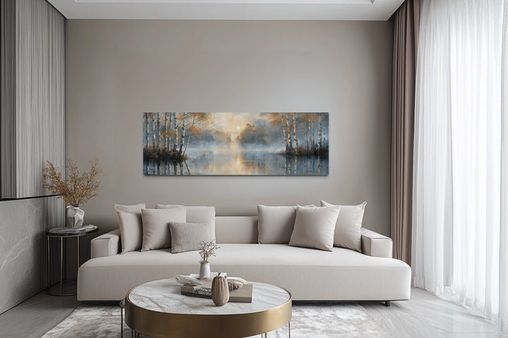 Silver birch trees forest long narrow horizontal wall art hanging above a modern beige sofa.