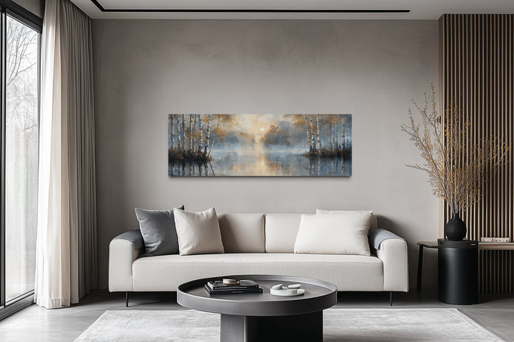 Silver birch trees forest long narrow horizontal wall art above a sofa in a modern living room.