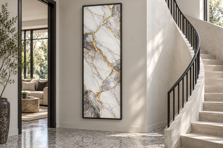 Vertical silver and gold marble canvas art with ivory formations and gray veins in a black frame.