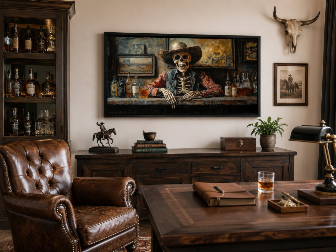 Skeleton cowboy barman framed canvas wall art in a rustic office with leather chair and desk.
