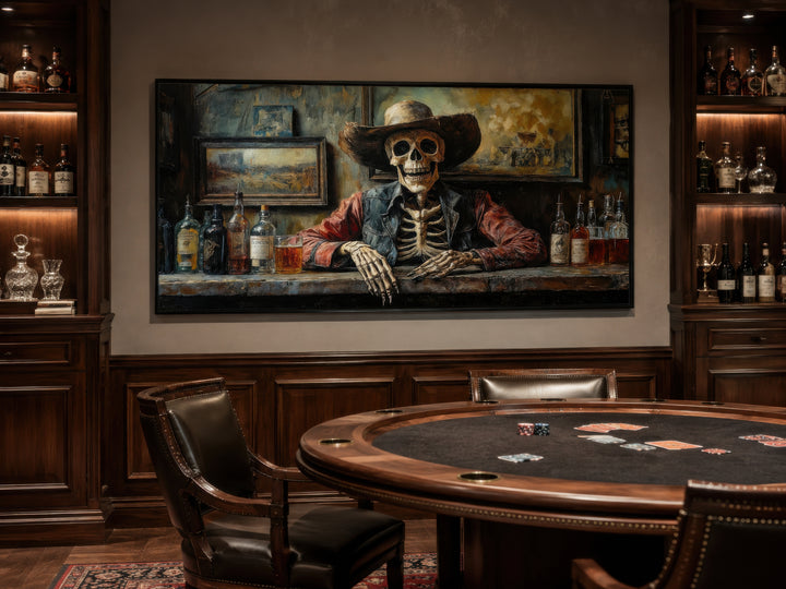 Skeleton cowboy barman framed canvas wall art hanging in a rustic home bar with a poker table.