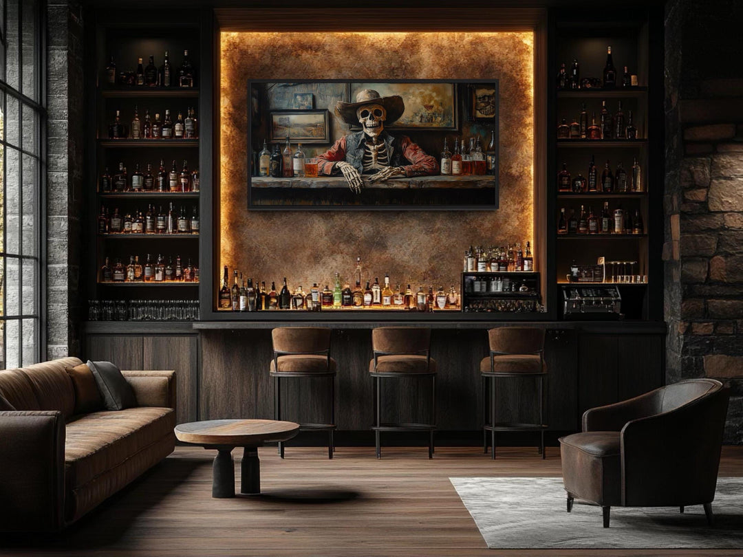 Framed canvas wall art of a skeleton cowboy barman in a saloon, displayed in a modern home bar.