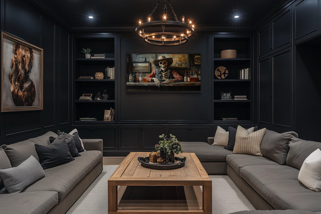 Skeleton cowboy barman framed canvas wall art centered in a dark, modern lounge with gray sofas.
