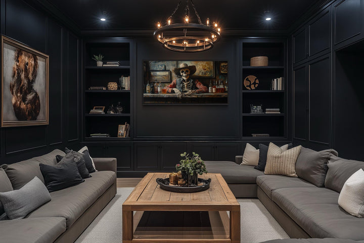 Skeleton cowboy barman framed canvas wall art centered in a dark, modern lounge with gray sofas.