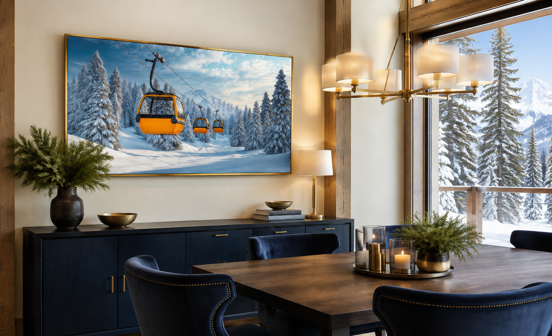 Yellow chairlift in a snowy ski resort framed canvas wall art above a dark blue sideboard.