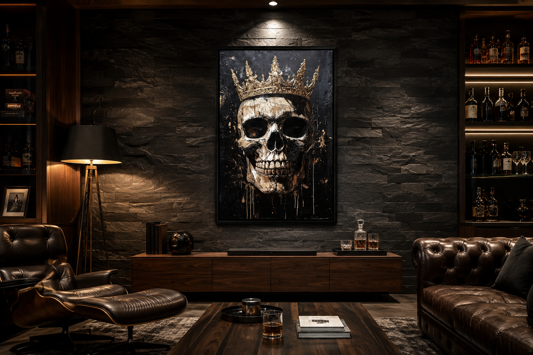 Skull wearing a gold crown gothic canvas wall art in a dark, modern living room with leather sofa.