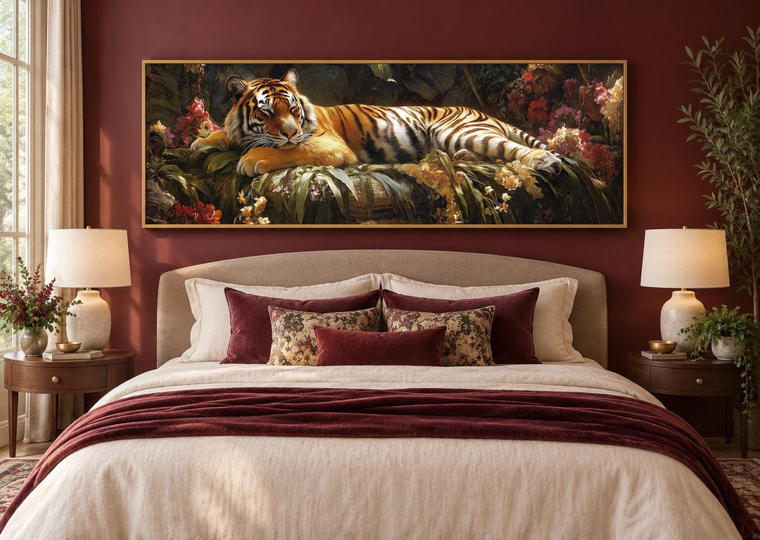Sleeping tiger long horizontal framed canvas wall art above a bed in a red-walled bedroom.