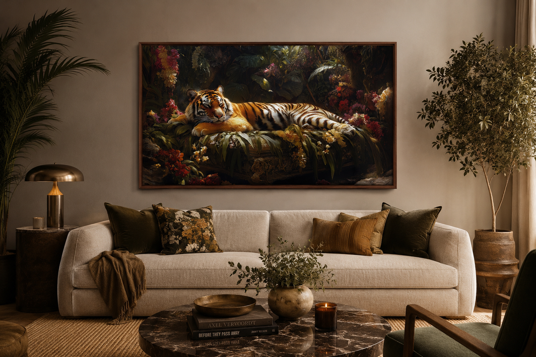 Framed canvas wall art of a tiger sleeping in a lush jungle, hung above a modern sofa.