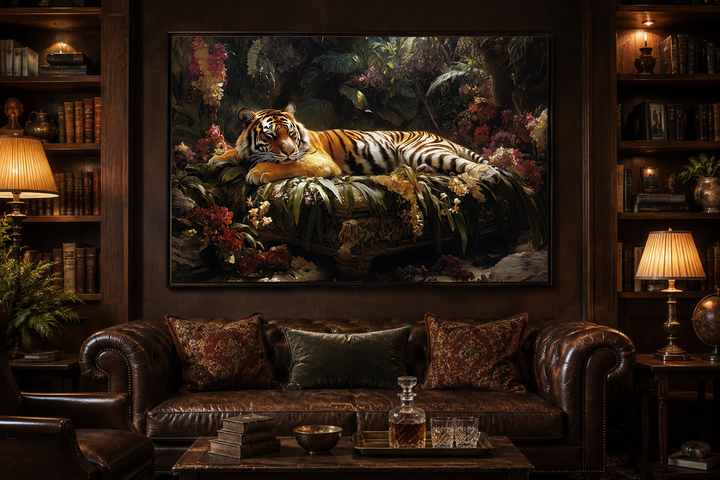 Framed canvas wall art of a tiger sleeping in a lush jungle, hanging above a leather sofa.