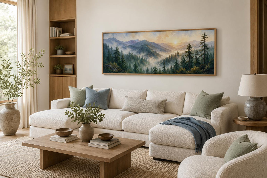 Panoramic Smoky Mountains sunrise canvas art above a cream sectional sofa in a rustic living room.