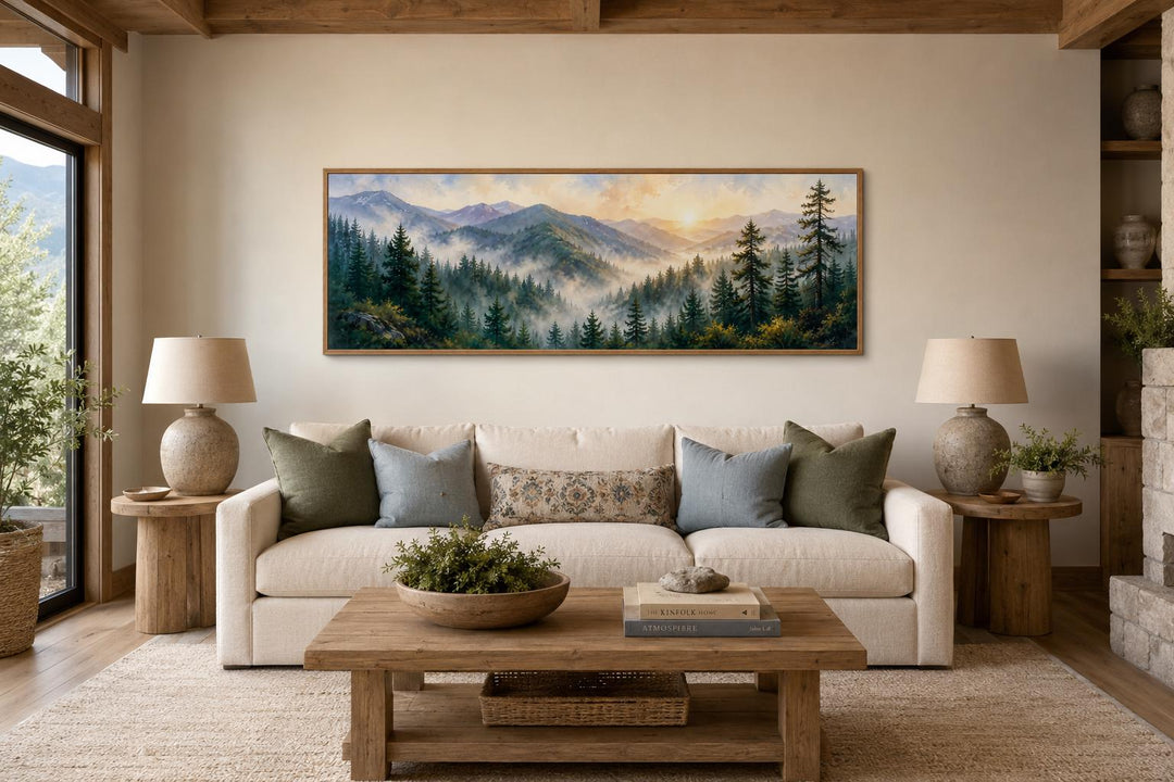 Smoky Mountains sunrise wall art above a couch in a rustic living room with pine forest landscape.