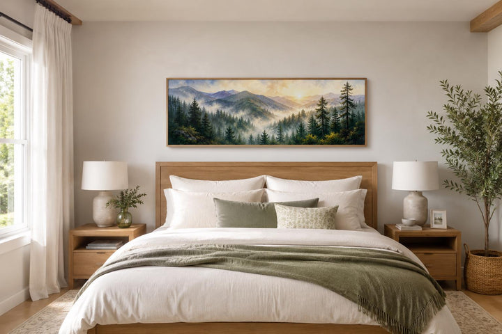 Panoramic Smoky Mountains sunrise wall art above a bed in a rustic, neutral-toned bedroom.