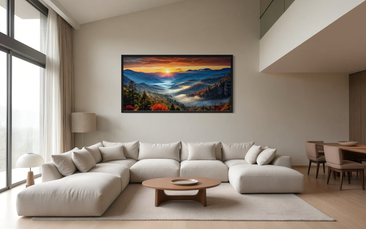 Smoky Mountains sunset canvas art above a modern white sectional sofa in a minimalist living room.