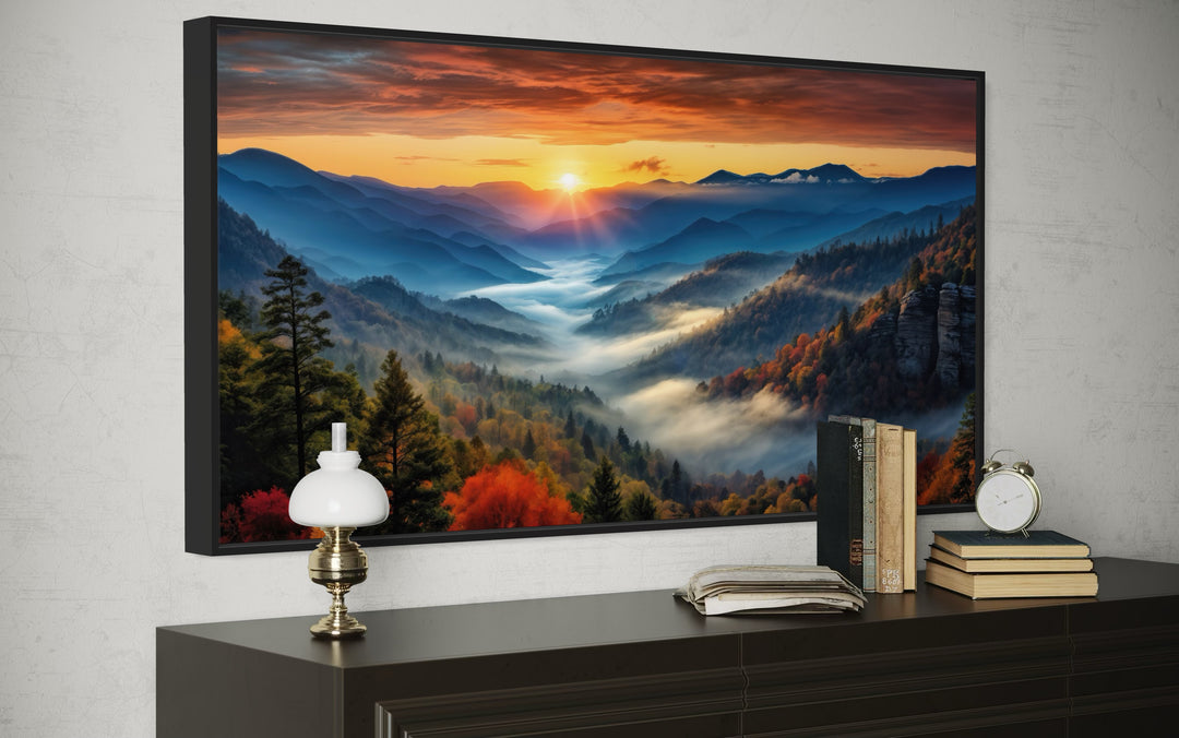 Smoky Mountains sunset canvas art in a black frame hanging above a dark wood dresser.
