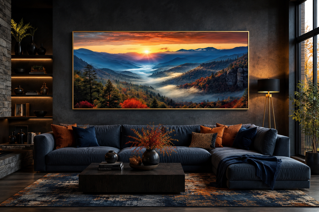 Smoky Mountains sunset canvas art in a gold frame above a dark blue sofa in a modern living room.