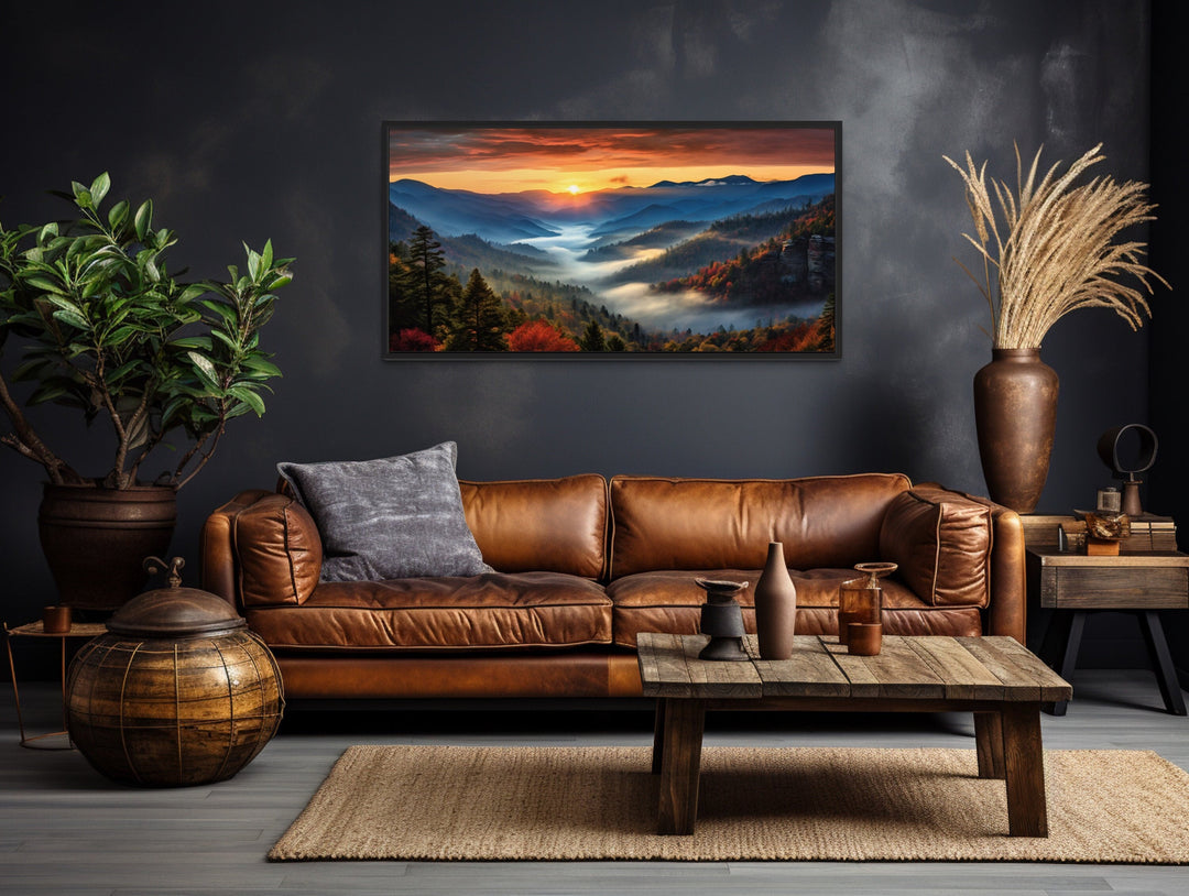 Smoky Mountains sunset canvas art above a brown leather sofa in a rustic living room.