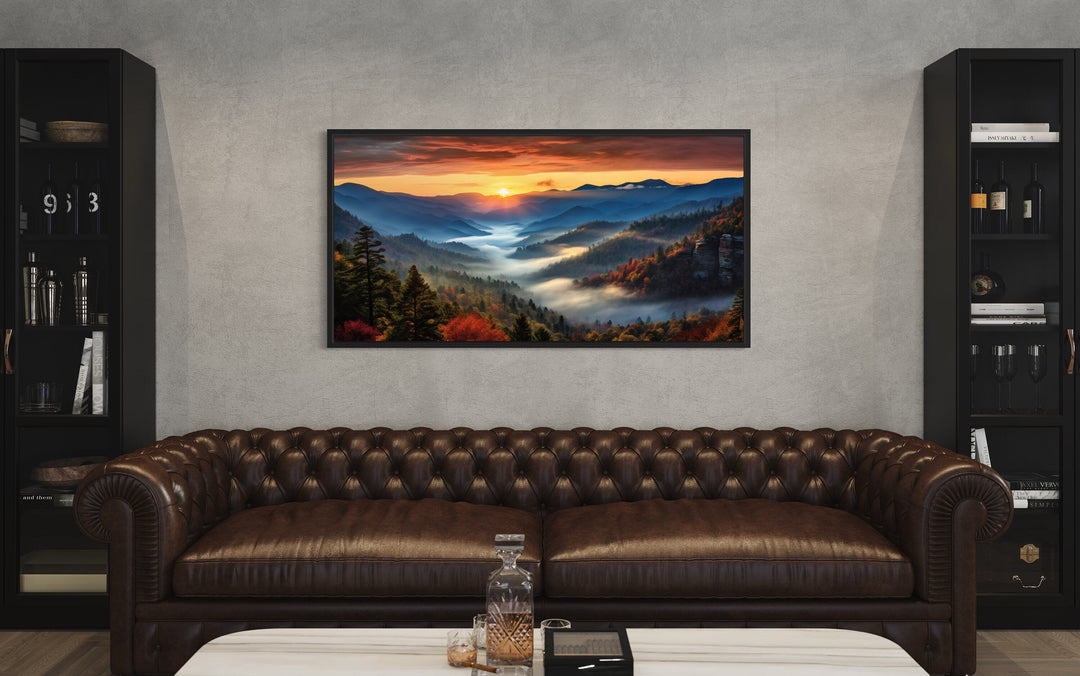 Smoky Mountains sunset canvas art hanging above a brown leather sofa in a modern living room.