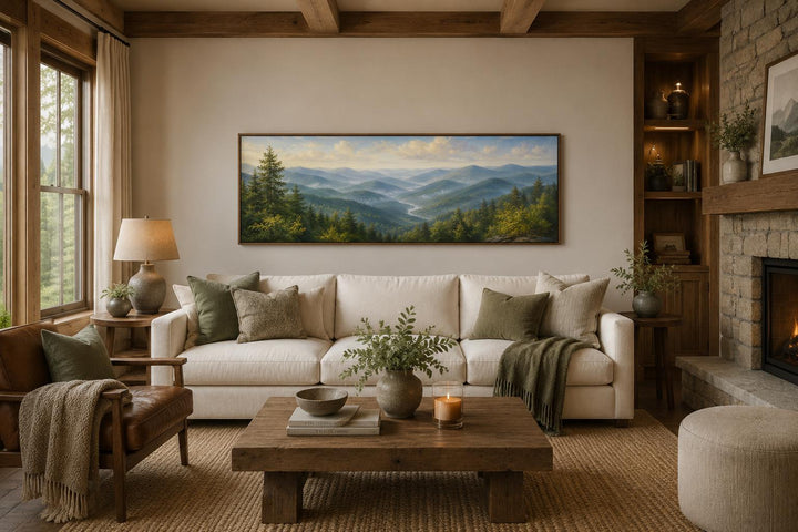 Panoramic Smoky Mountains canvas art showing misty blue ridges and green forests above a sofa.