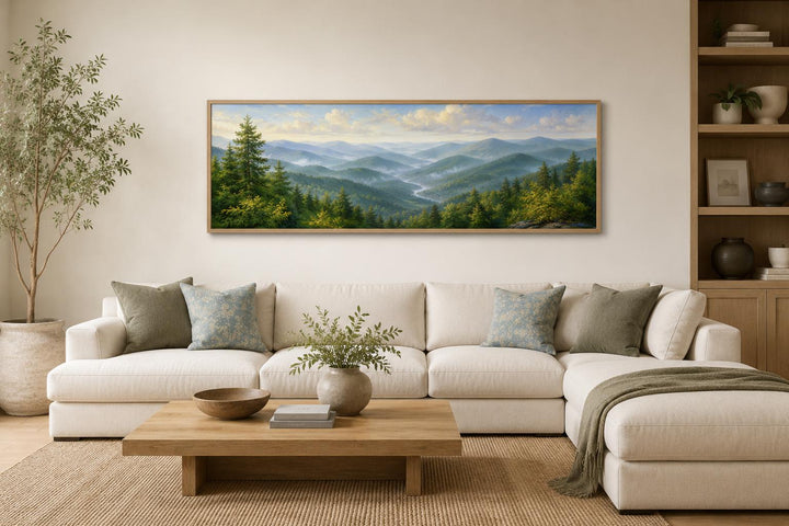 Panoramic Smoky Mountains canvas art above a cream sofa in a rustic, modern living room.