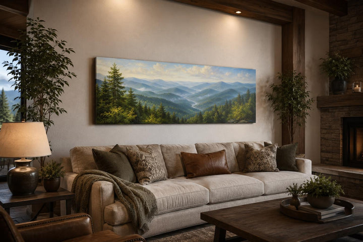 Panoramic Smoky Mountains canvas art showing misty blue ridges and green forests above a sofa.