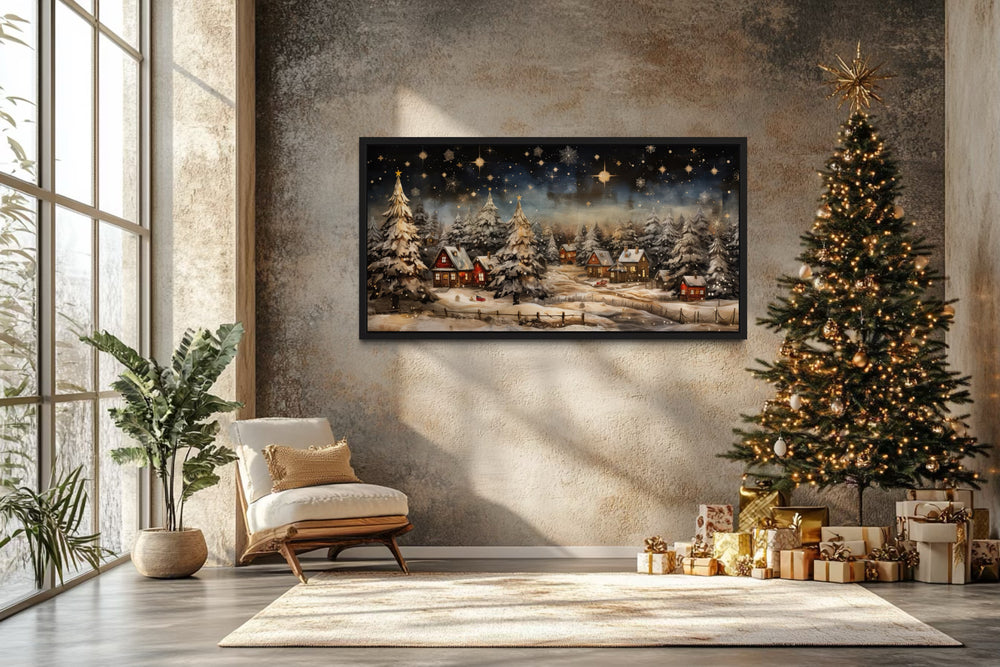 Snow-covered winter village at night wall art in a cozy room with a Christmas tree and gifts.