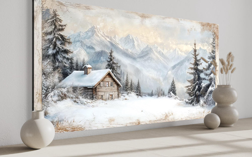 Snowy mountain cabin canvas art featuring a rustic lodge, pine trees, and alpine peaks.