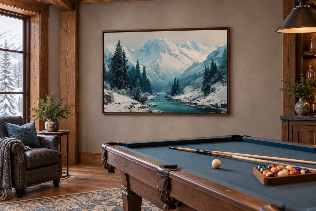 Snowy mountain river canvas wall art hanging in a rustic room above a blue pool table.